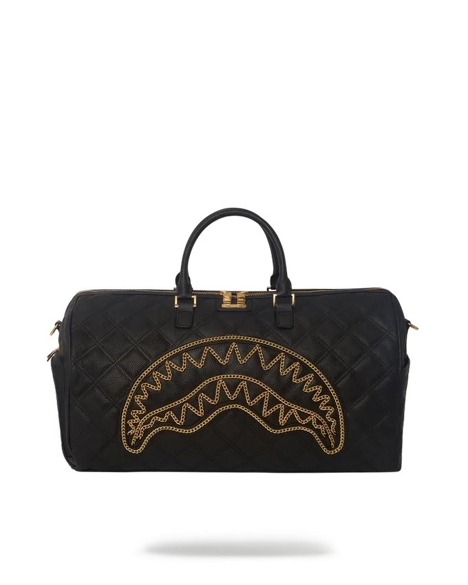 BOLSO DE VIAJE NOIR QUILT CON CADENA DORADA Y DETALLE DE TIBURÓN