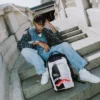 Mochila «Sharks in Paris» con ilusión óptica «Bag on Bag»