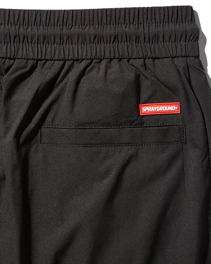 PANTALONES CORTAVIENTO CON BLOQUES DE COLOR